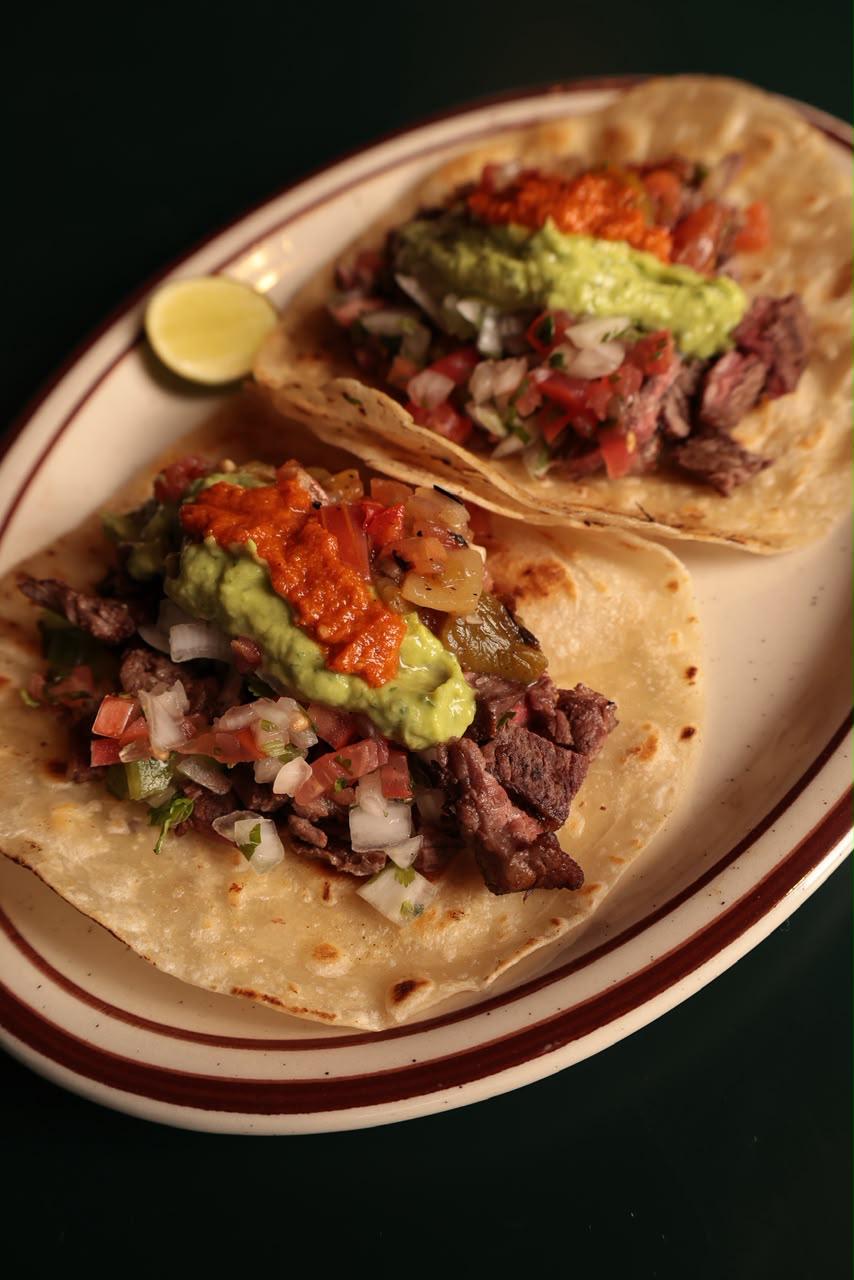 Grilled steak tacos with guacamole at Lomas